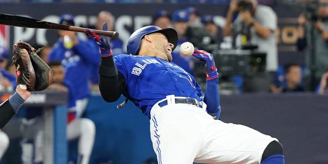 George Springer of the Toronto Blue Jays is hit by a pitch during the eighth inning against the Seattle Mariners in Game 1 of the American League wild-card series at Rogers Centre on Oct. 7, 2022, in Toronto.