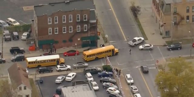 School busses arrive to evacuate students from the Central Visual and Performing Arts high school in St. Louis following a shooting. (KTVI)
