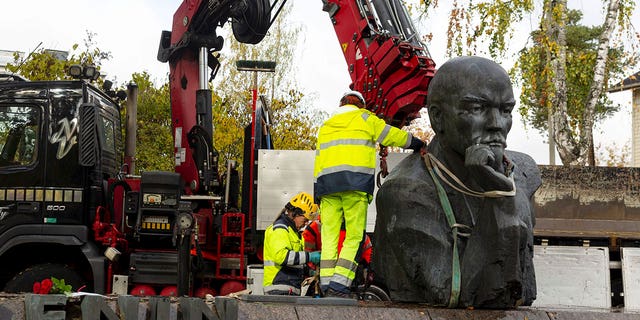 A statue of Vladimir Lenin is being removed from the streets of Kotka, Finland, on Oct. 4, 2022. 