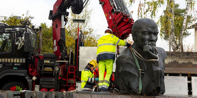 A statue of Vladimir Lenin is being removed from the streets of Kotka, Finland, on Oct. 4, 2022.