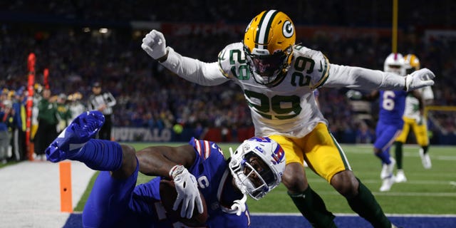 Stefon Diggs #14 of the Buffalo Bills catches a touchdown pass during the first quarter against the Green Bay Packers at Highmark Stadium on October 30, 2022 in Orchard Park, New York.