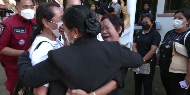 Parents and relatives grieve after identifying their children who were murdered in Thailand.