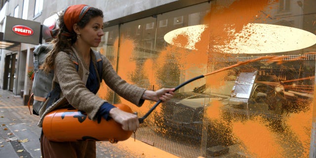 Just Stop Oil protestors vandalize the storefronts of Ferrari, Bugatti and Bentley dealerships in central London Wednesday morning.