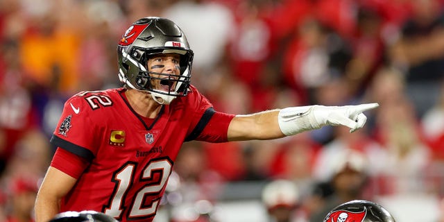 Tom Brady #12 of the Tampa Bay Buccaneers signals at the line of scrimmage against the Baltimore Ravens during the fourth quarter at Raymond James Stadium on October 27, 2022 in Tampa, Florida.