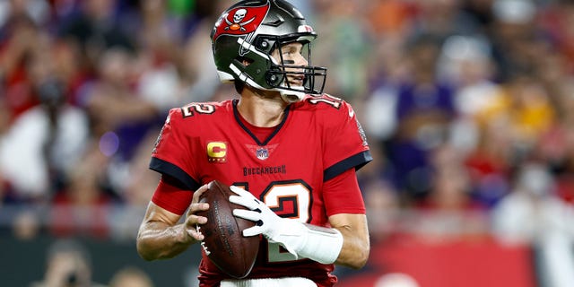 Tom Brady #12 of the Tampa Bay Buccaneers looks to pass against the Baltimore Ravens during the second quarter at Raymond James Stadium on October 27, 2022 in Tampa, Florida.