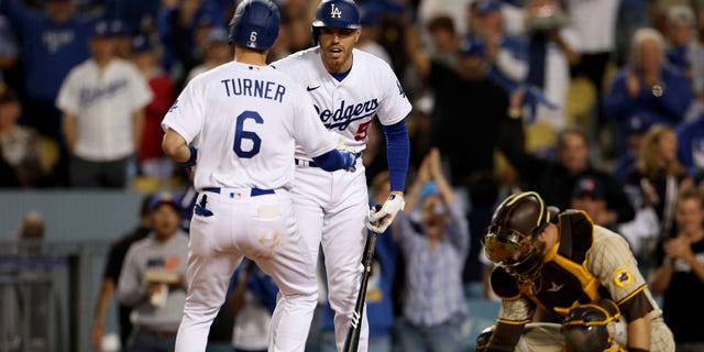 Tree Turner #6 of the Los Angeles Dodgers celebrates his single home run in the third inning with Freddie Freeman #5 in game two of the National League Division Series against the San Diego Padres at Dodger Stadium on October 12, 2022 in Los Angeles, California celebrated. ,