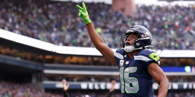 Tyler Lockett of the Seattle Seahawks celebrates a touchdown against the New York Giants during the fourth quarter on Oct. 30, 2022, in Seattle.