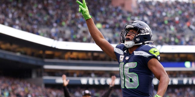 Tyler Lockett of the Seattle Seahawks celebrates a touchdown against the New York Giants during the fourth quarter on Oct. 30, 2022, in Seattle.