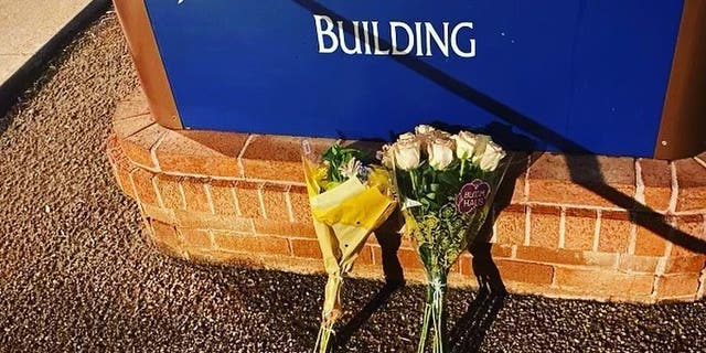 The University of Arizona Police Department shared a photo of flowers outside a campus building Wednesday evening hours after a professor was shot and killed in an office.
