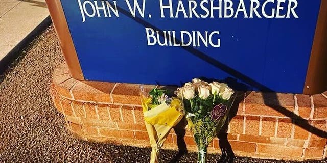 The University of Arizona Police Department shared a photo of flowers outside a campus building Wednesday evening hours after a professor was shot and killed in an office.