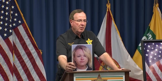 Polk County Sheriff Grady Judd holds a photo of Cheryl Lynn Williams.