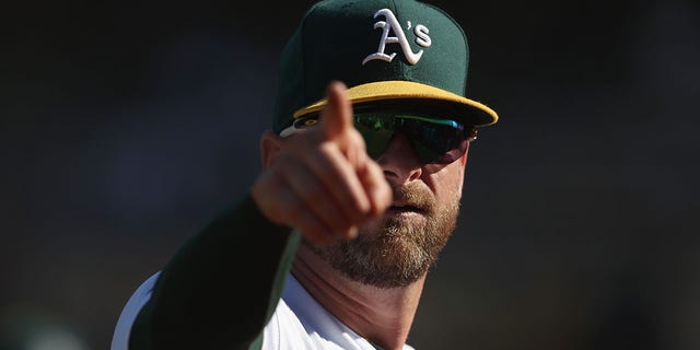 Stephen Vogt of the Oakland Athletics points to the fans during the game against the Seattle Mariners at RingCentral Coliseum on September 22, 2022 in Oakland, California.