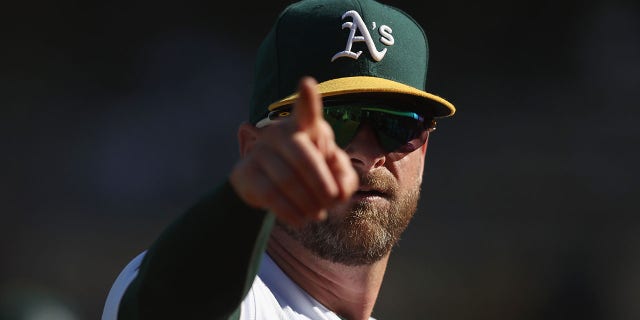 Stephen Vogt of the Oakland Athletics points to the fans during the game against the Seattle Mariners at RingCentral Coliseum on September 22, 2022 in Oakland, California.