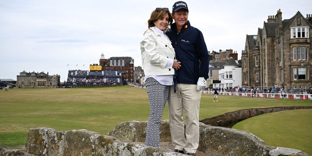 Tom Watson and wife LeslieAnne Wade pose at the Swilcan Bridge on the 18th hole during the Celebration of Champions prior to The 150th Open at St. Andrews Old Course July 11, 2022, in St Andrews, Scotland.