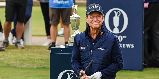 Tom Watson smiles as he walks past the Claret Jug on the first tee during the Celebration of Champions Challenge during practice for The 150th Open Championship on The Old Course at St. Andrews July 11, 2022, in St. Andrews, Scotland. 