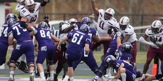 Kyle Thompson #61 of the Weber State Wildcats kicks a field goal over the Southern Illinois Salukis during their game April 24, 2021, at Stewart Stadium in Ogden, Utah. 