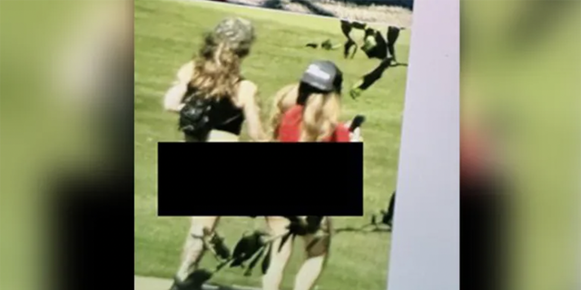 Photos acquired by Fox 7 Austin appear to show two women from an adult entertainment club walking on the course. 