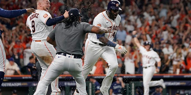 Houston Astros designated hitter Yordan Alvarez (44) celebrates with teammates after his three-run, walkout home run against the Seattle Mariners during the ninth inning in Game 1 of an American League Division Series baseball game in Houston, Tuesday, Oct. 11, 2022.