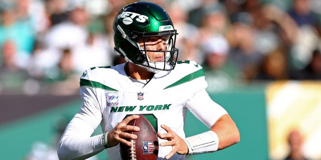 Zach Wilson #2 of the New York Jets looks to pass during the third quarter at MetLife Stadium on October 09, 2022 in East Rutherford, New Jersey.