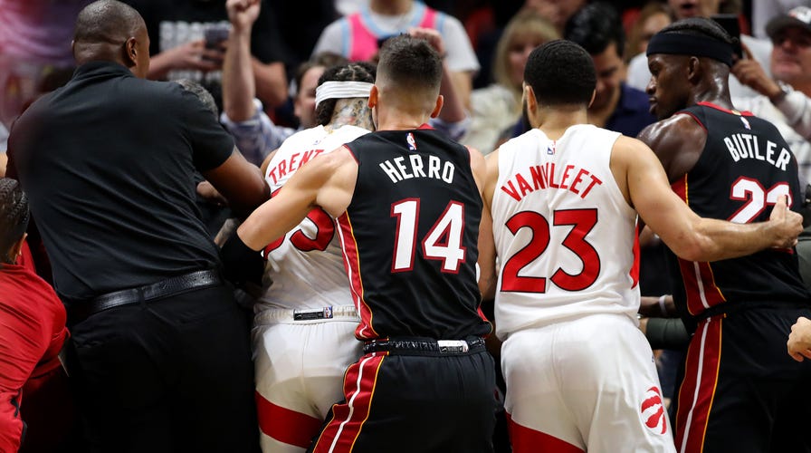 Heat's Caleb Martin Tackles Raptors' Christian Koloko Into Stands ...