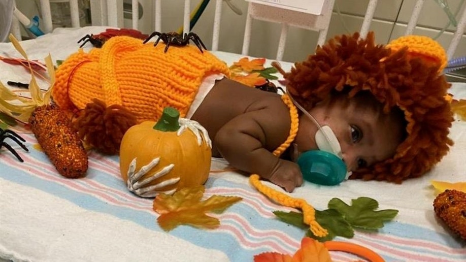 Infant dressed as a lion