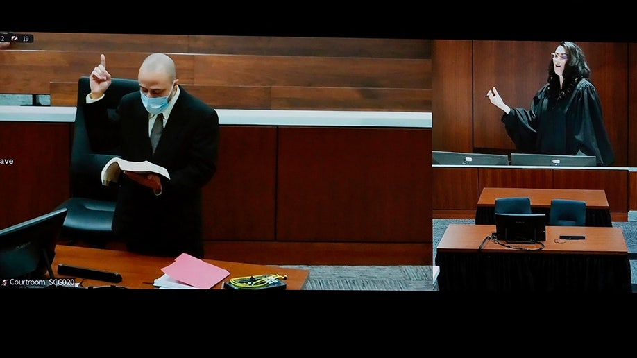Darrell Brooks reads from the Bible after he was removed from the main courtroom