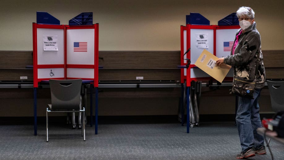 Man walking across voting stations