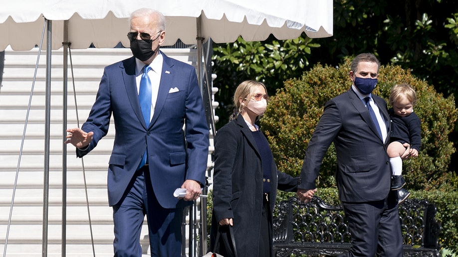 A photo of Joe Biden, Hunter Biden, and Melissa Cohen Biden