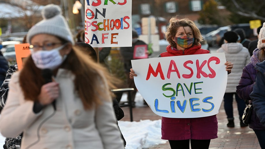 People gather in support of continuing the school mask mandate