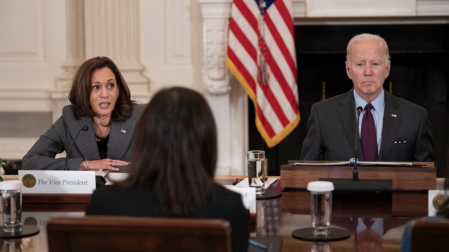 A photo of Joe Biden sitting next to Kamala Harris