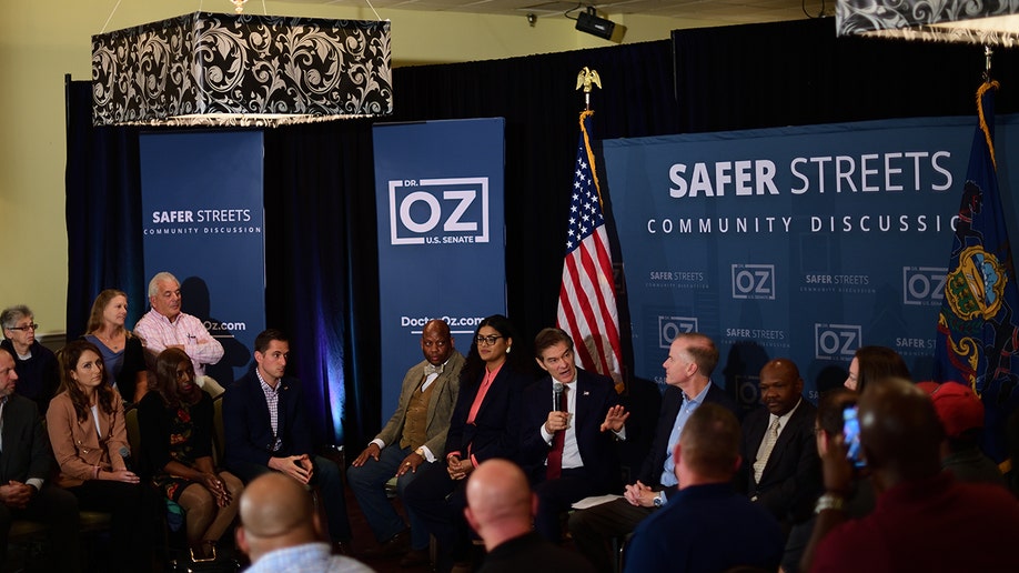 A photo of Dr. Oz sitting, speaking at an event