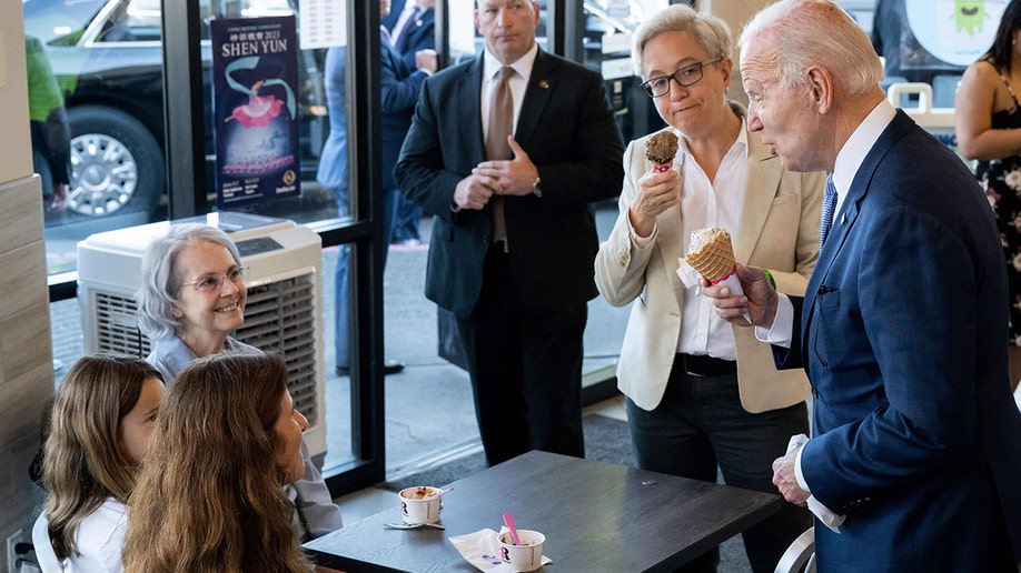 Biden speaking with people in an ice cream shop