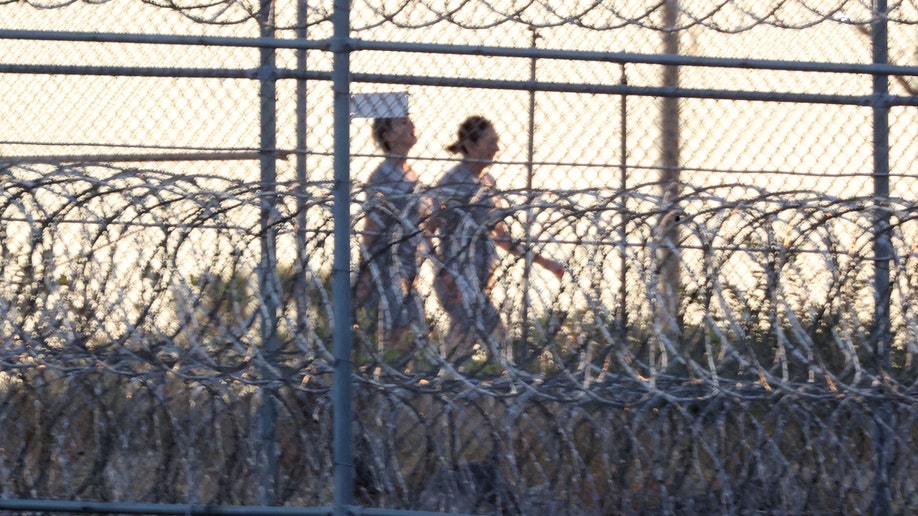 Ghislaine Maxwell walks outside Florida prison with a buddy