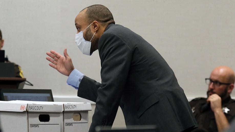 Darrell Brooks gestures in court