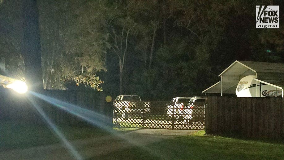 Cars outside a home in Georgia after toddler believed to be dead
