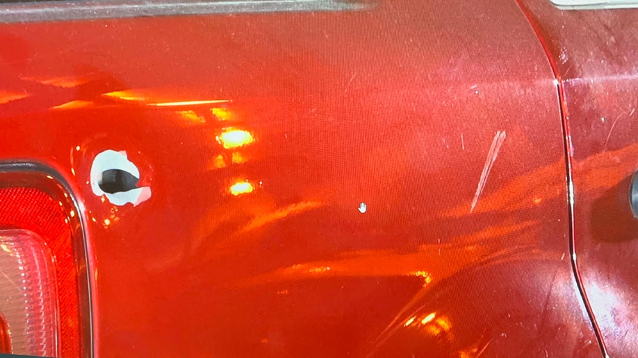 Bullet hole in Darrell Brooks' red SUV