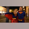 Couple dressed as Superman and Supergirl