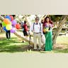 Two people dressed as Disney characters: Carl Fredricksen from "Up" and Princess Ariel from "The Little Mermaid."