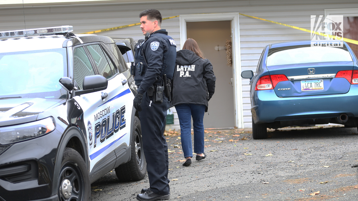 Police search a home in Moscow, Idaho on Monday, November 14, 2022, where four University of Idaho students were killed over the weekend in an apparent quadruple homicide.