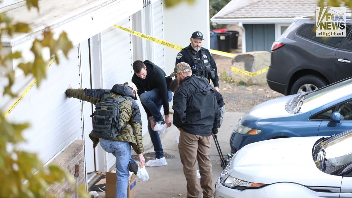 Idaho investigators at the scene of a quadruple homicide