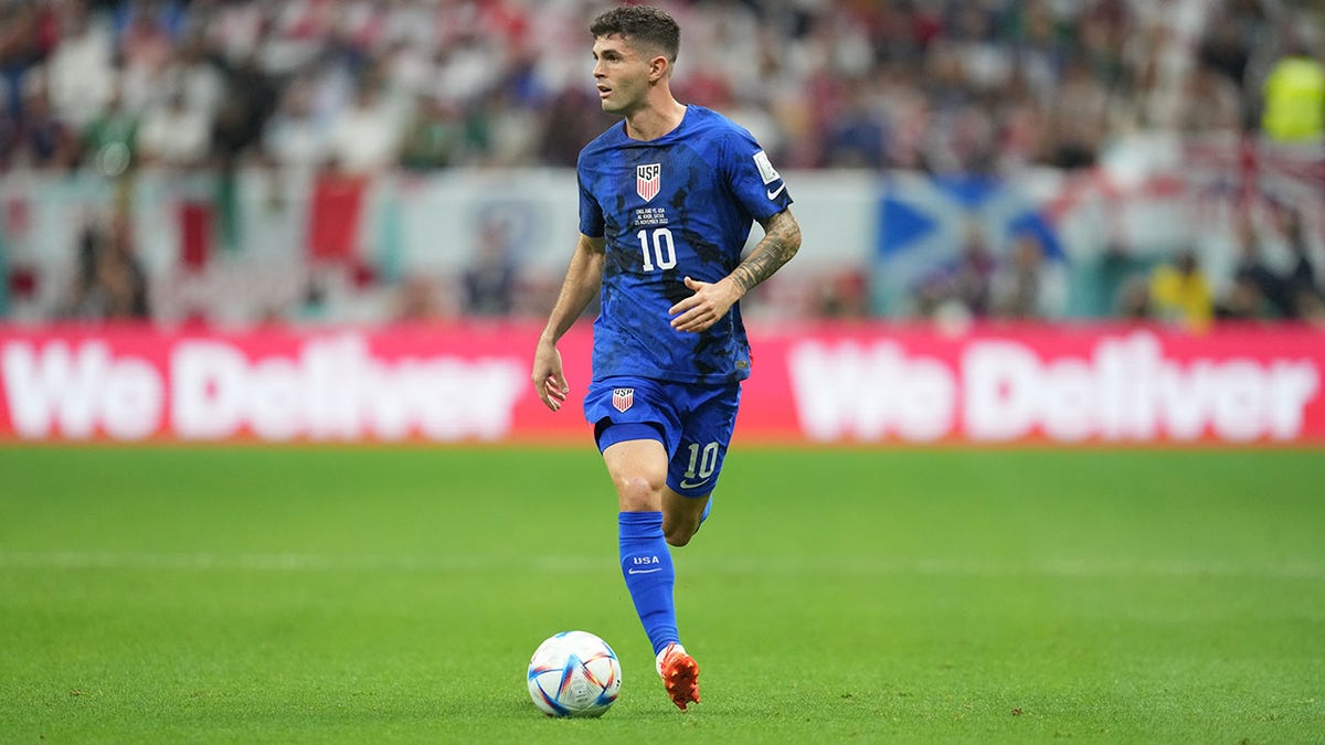 Christian Pulisic advances the ball