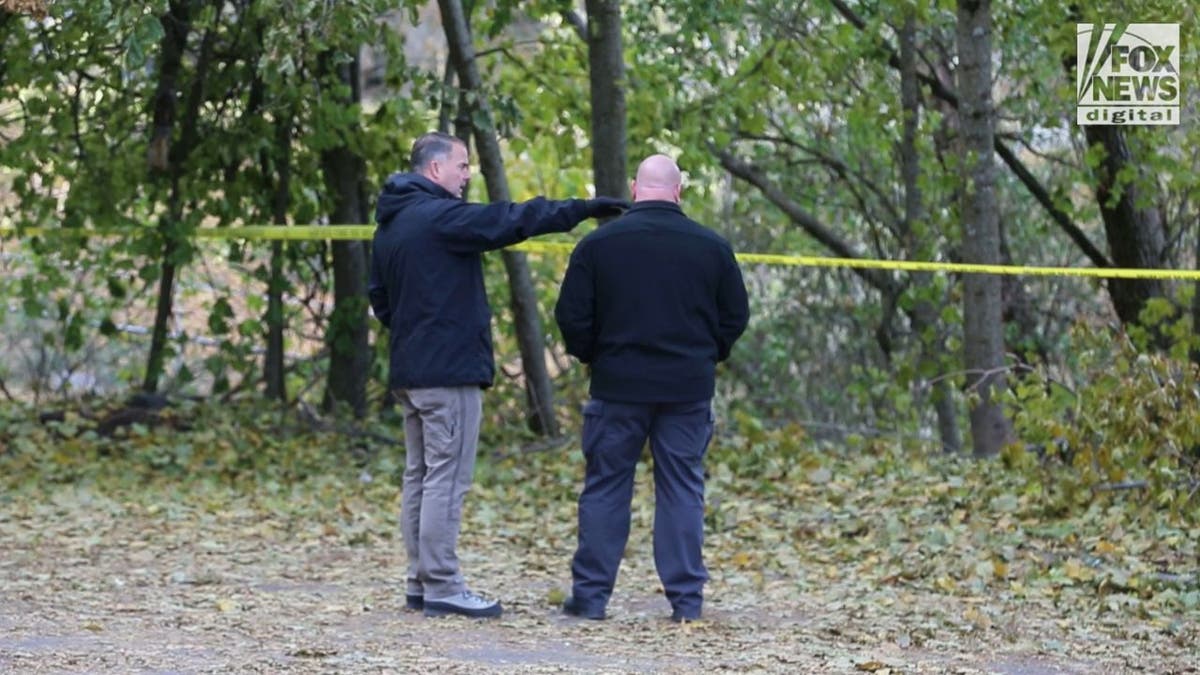 Idaho investigators near wooded area