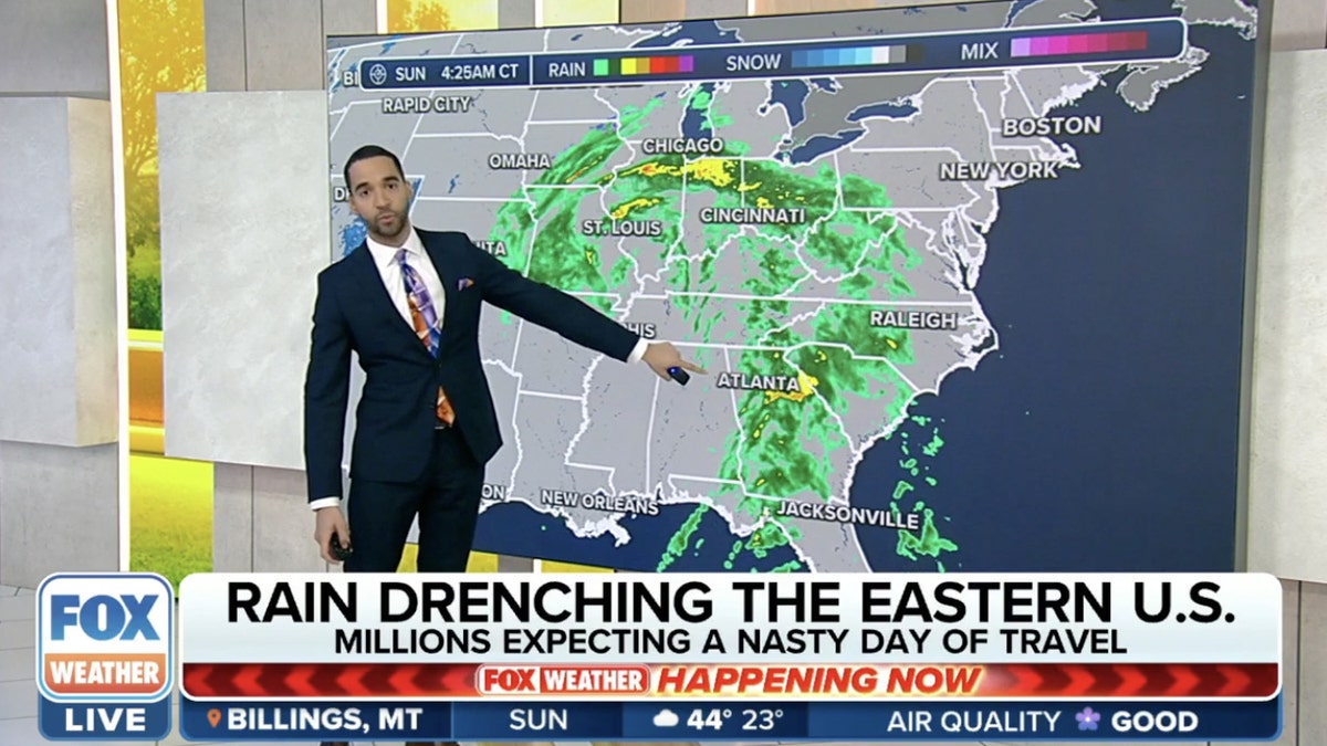 Fox Weather anchor in front of map showing rain