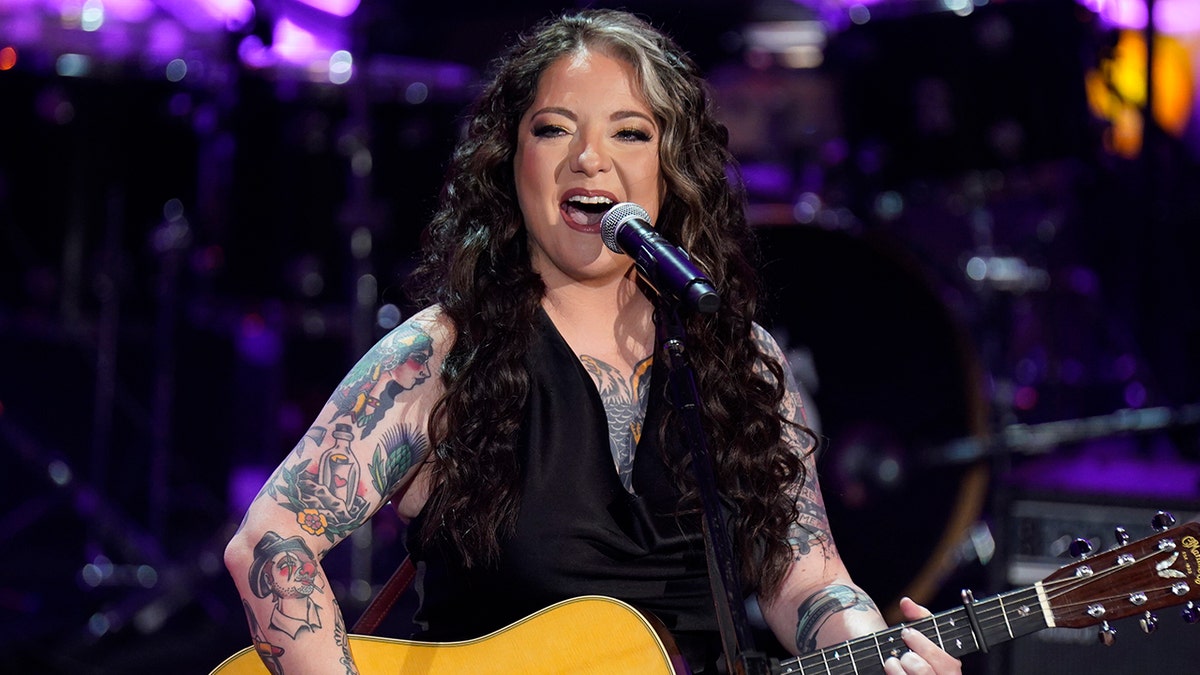 Ashley McBryde on stage honoring Naomi Judd