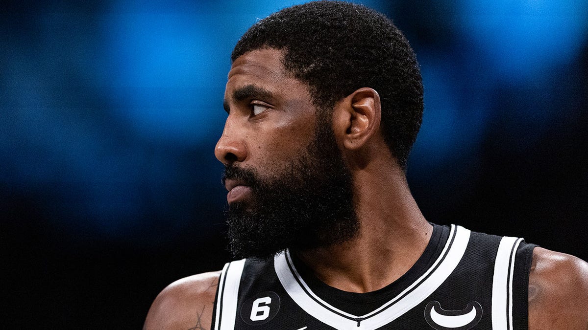 Kyrie Irving looking on