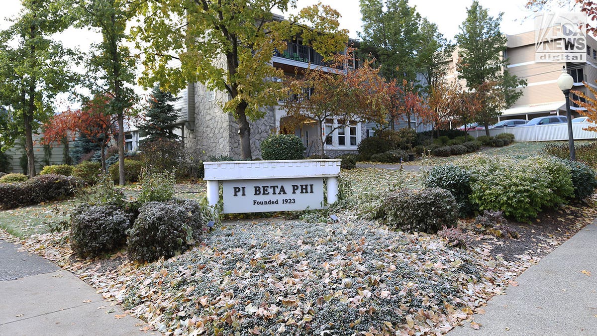 Street view of the sorority house with the Pi Beta Phi House sign out front.