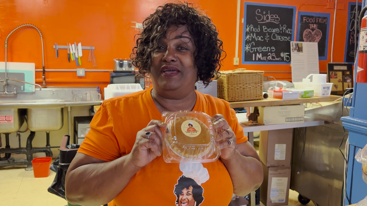 Cheryl holds up one of her sweet potato pies