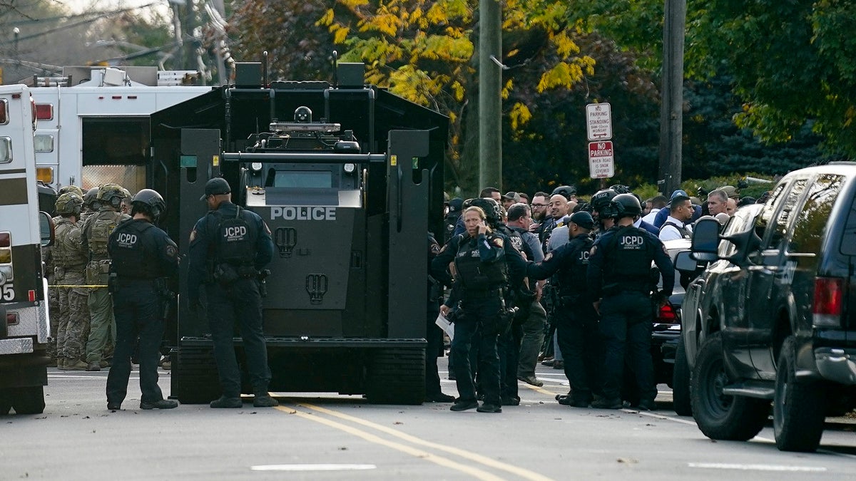 nj police gathering near swat vehicle in Newark