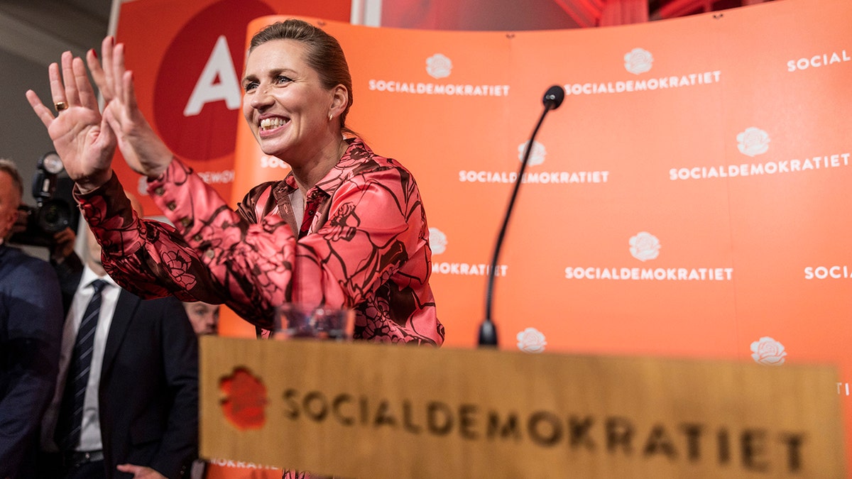 Denmark's Mette Frederiksen excited behind podium