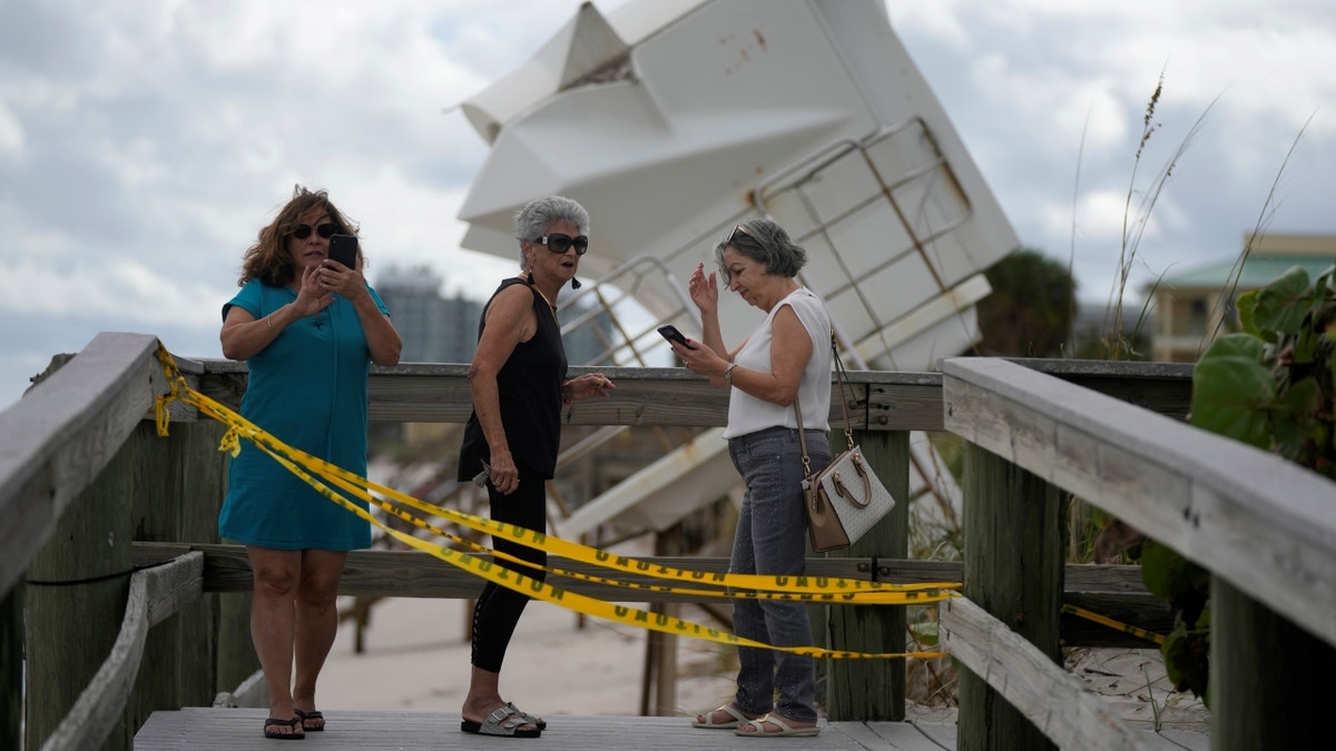 Florida residents near storm damage